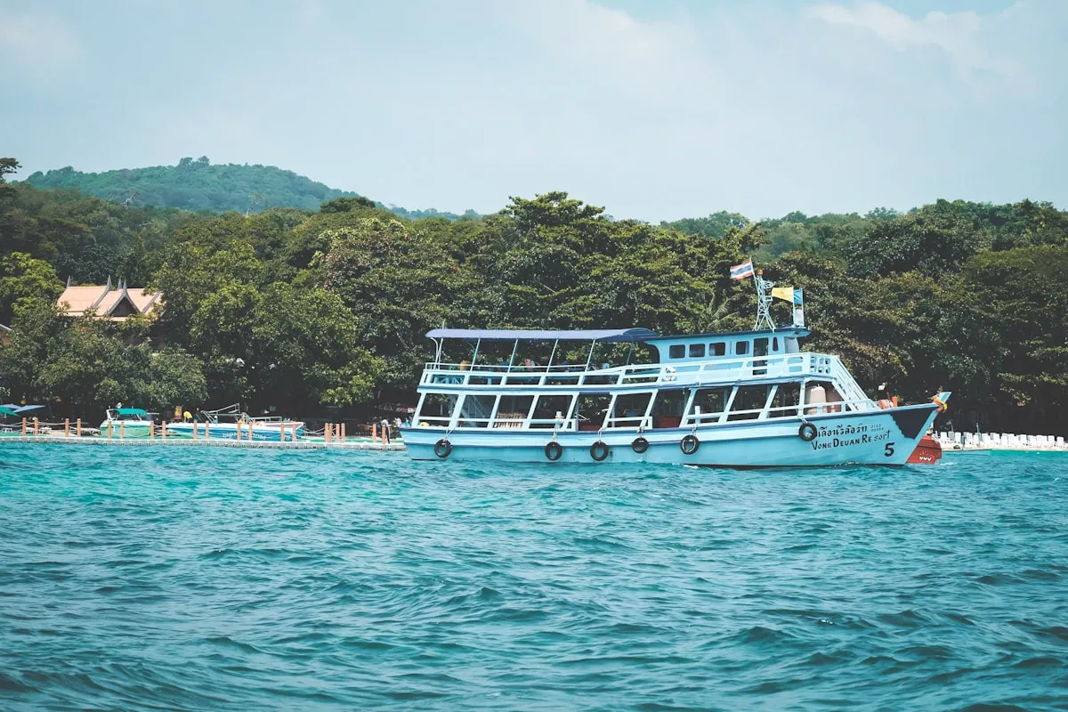 White yacht cruising on calm ocean waters